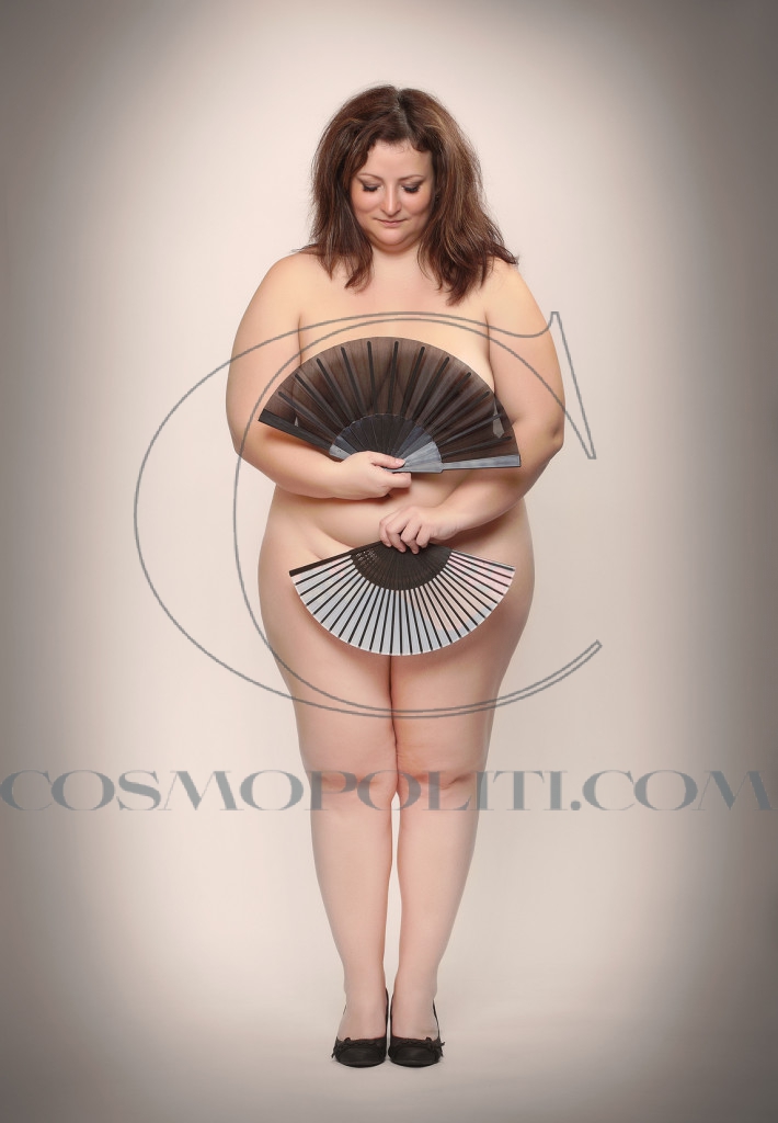 Retro picture of a naked overweight woman with oriental fan.
