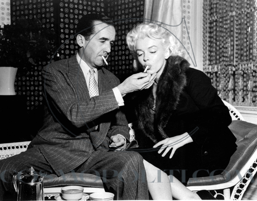 Edward R. Murrow Lights Cigarette For Marilyn Monroe