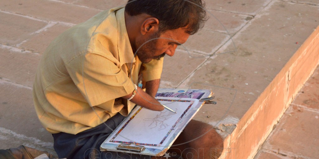 PUSHKAR, RAJASTHAN, INDIA - 2015/09/11: A handicapped artist, Bhagirath Sharma at Pushkar Ghat is painting a tree. He is from a small village in Nokha. (Photo by Shaukat Ahmed/Pacific Press/LightRocket via Getty Images)