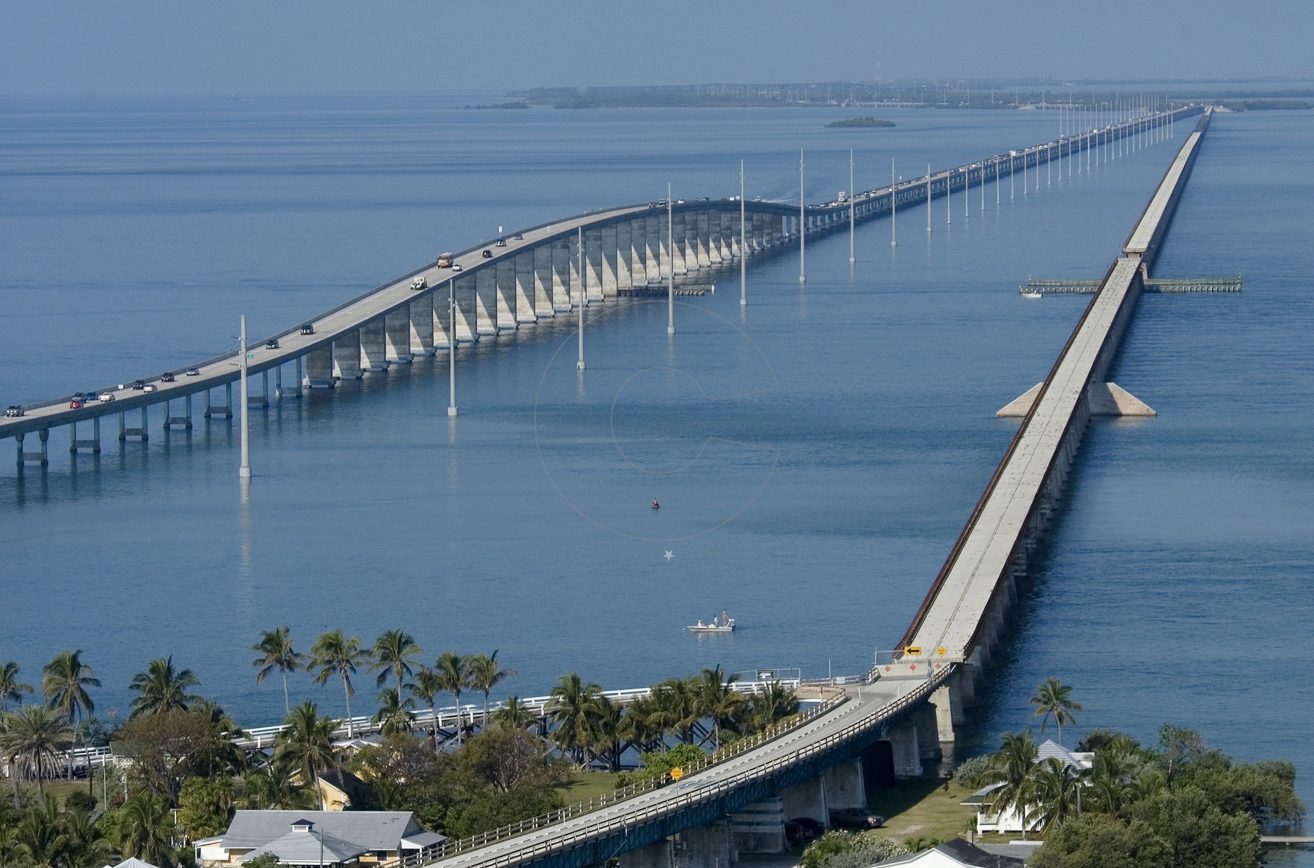 The historic old Seven Mile Bridge in the Florida Keys near Marathon, Fla., is shown at right, cutting through Pigeon Key, a small island that once housed workers who aided the effort to build Henry Flagler's Overseas Railroad. The more modern span, completed in 1982, is at left. (Photo by Andy Newman/Florida Keys News Bureau)