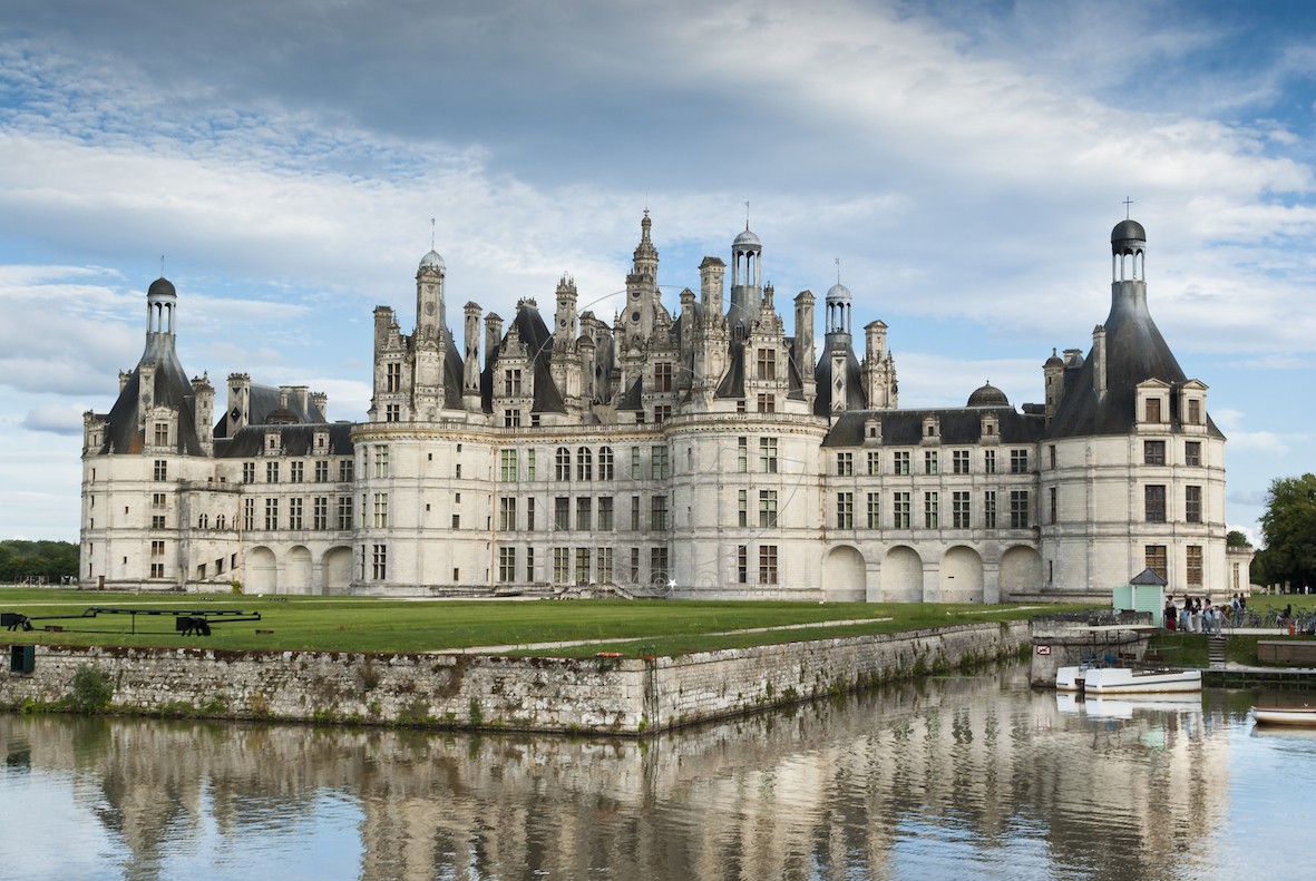 Chambord - France - August 21, 2008: The facade of Chambord Castle, a very famous medieval castle of the French Renaissance architecture. Tourists in the photo.