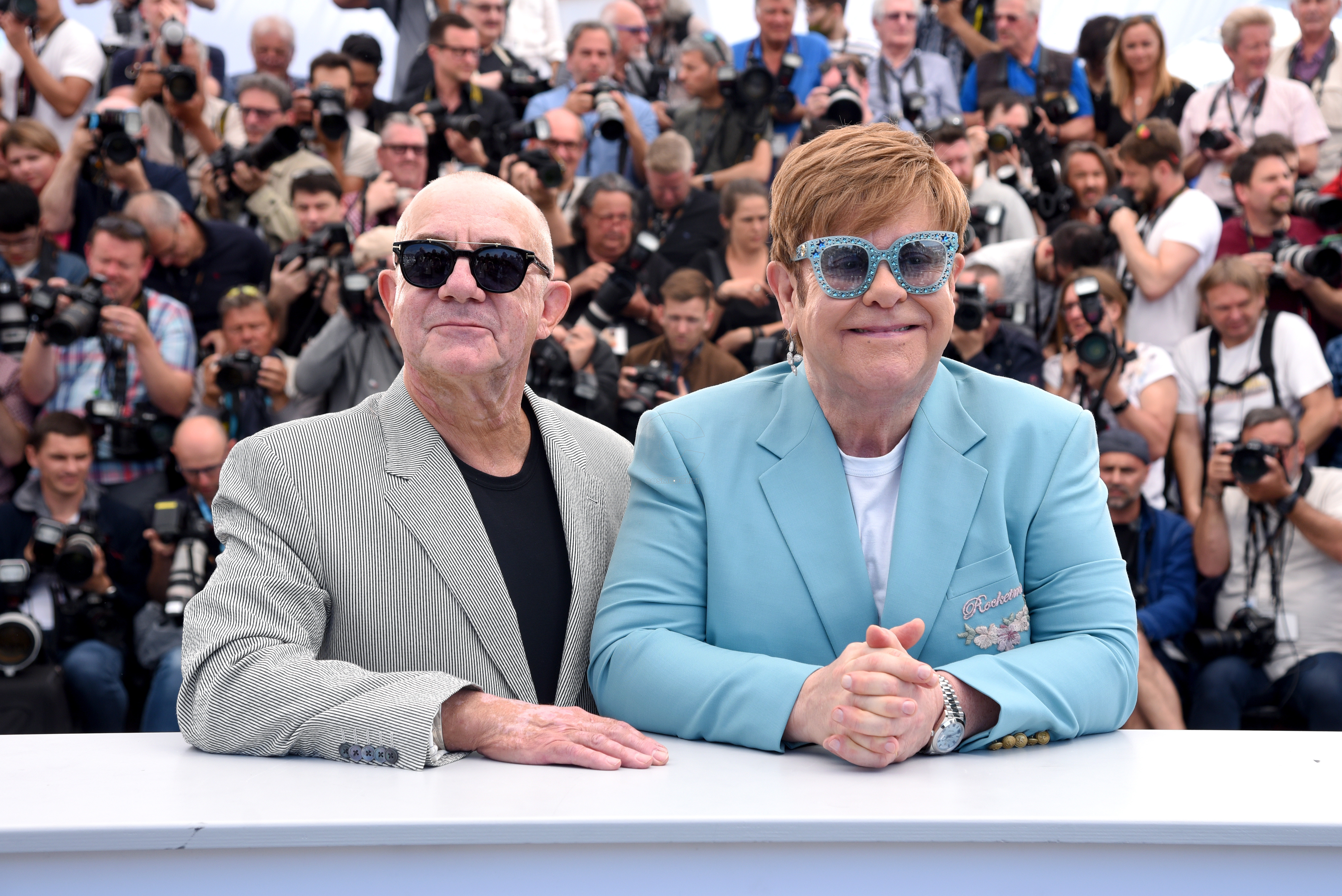 CANNES, FRANCE  - MAY 16: (L-R) Bernie Taupin and Elton John attend the "Rocketman" Photocall during the 72nd annual Cannes Film Festival on May 16, 2019 in Cannes, France. (Photo by Serge Arnal/Paramount)